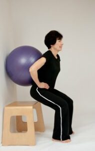 squats with ball against wall